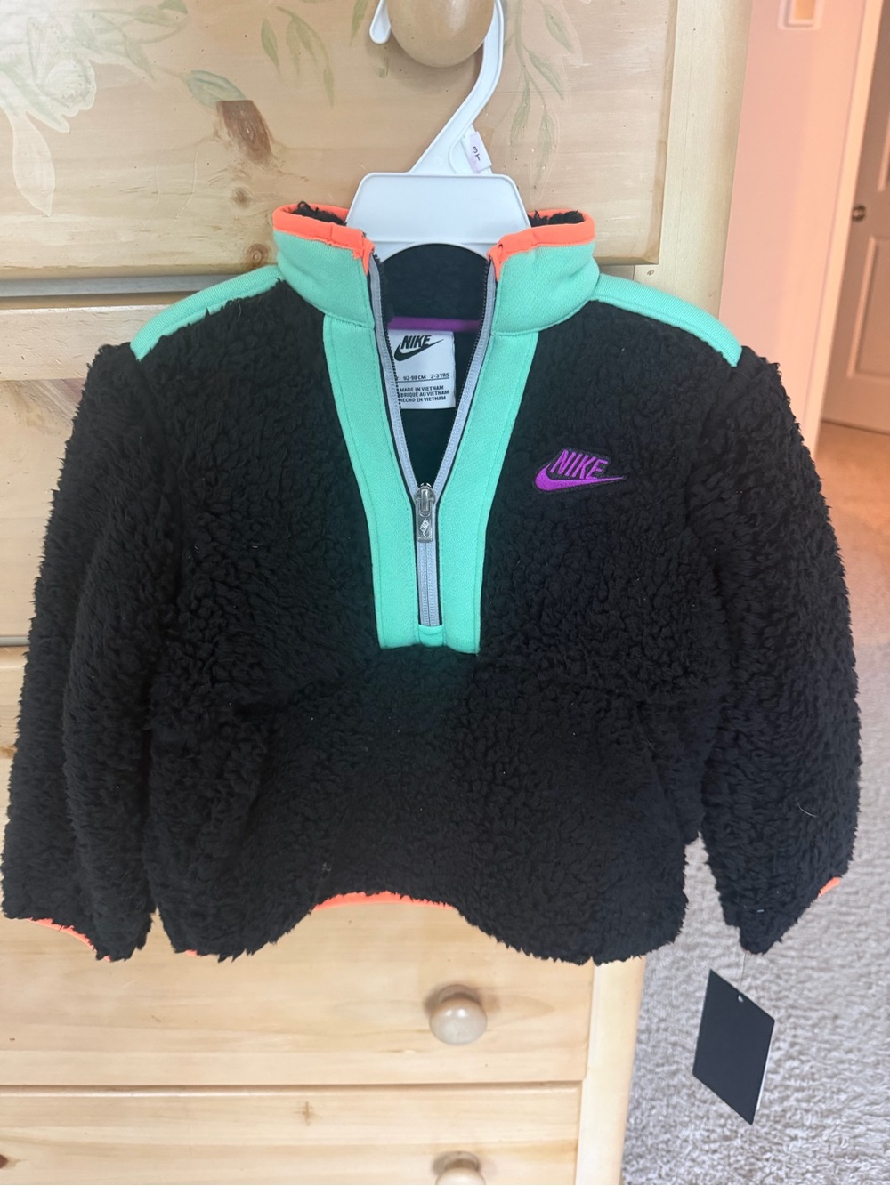 Nike Kids Black Sherpa Pullover with Mint Trim and Coral Accents
